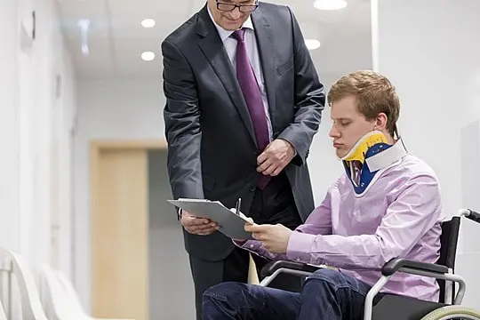 Accident compensation lawyer and injured man