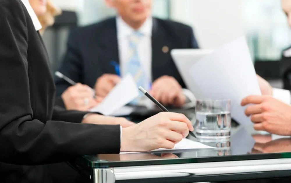Business team discussing corporate and commercial law